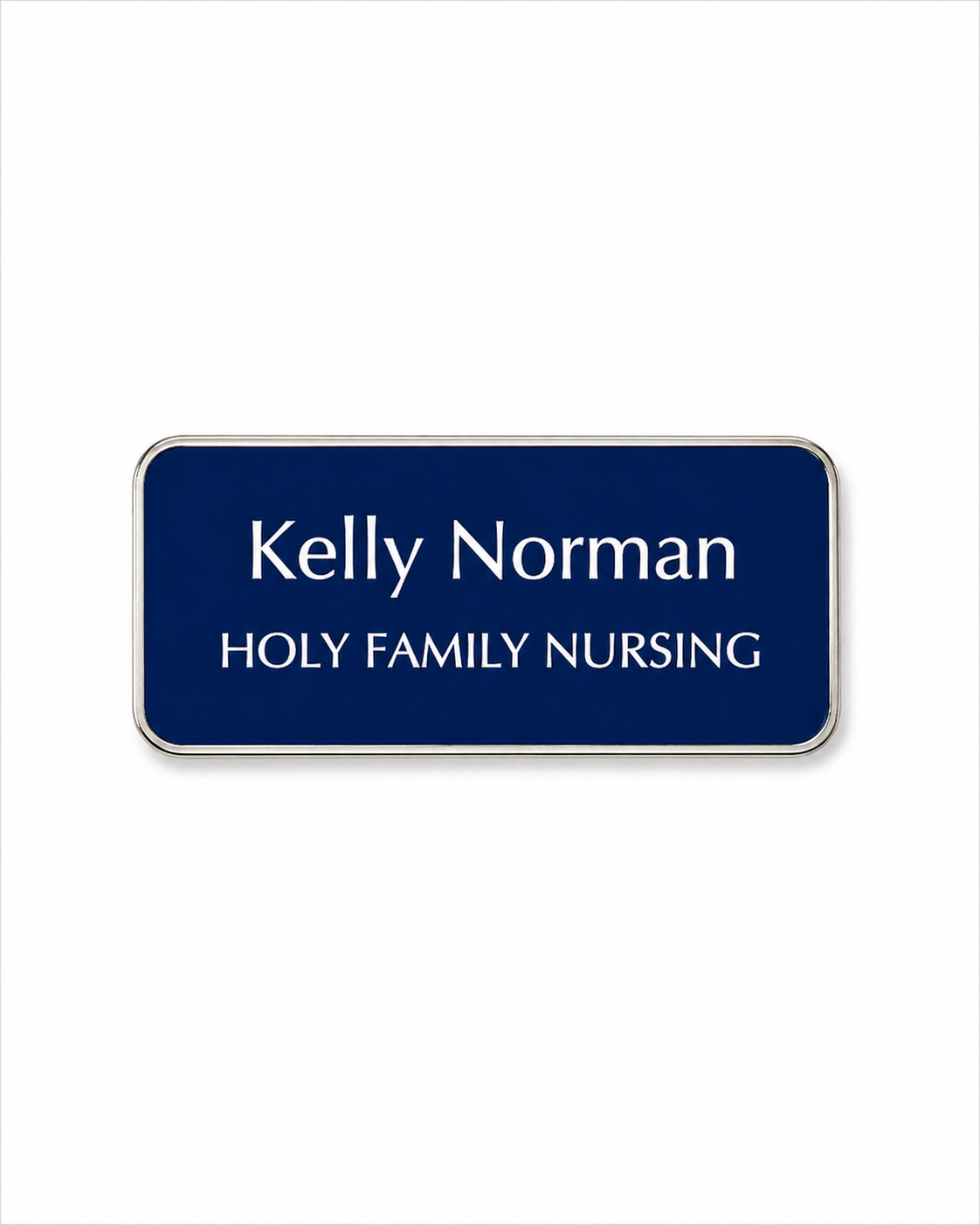 Navy blue name tag with 'Kelly Norman' and 'Holy Family Nursing' text on a white background
