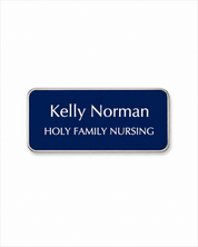 Navy blue name tag with 'Kelly Norman' and 'Holy Family Nursing' text on a white background